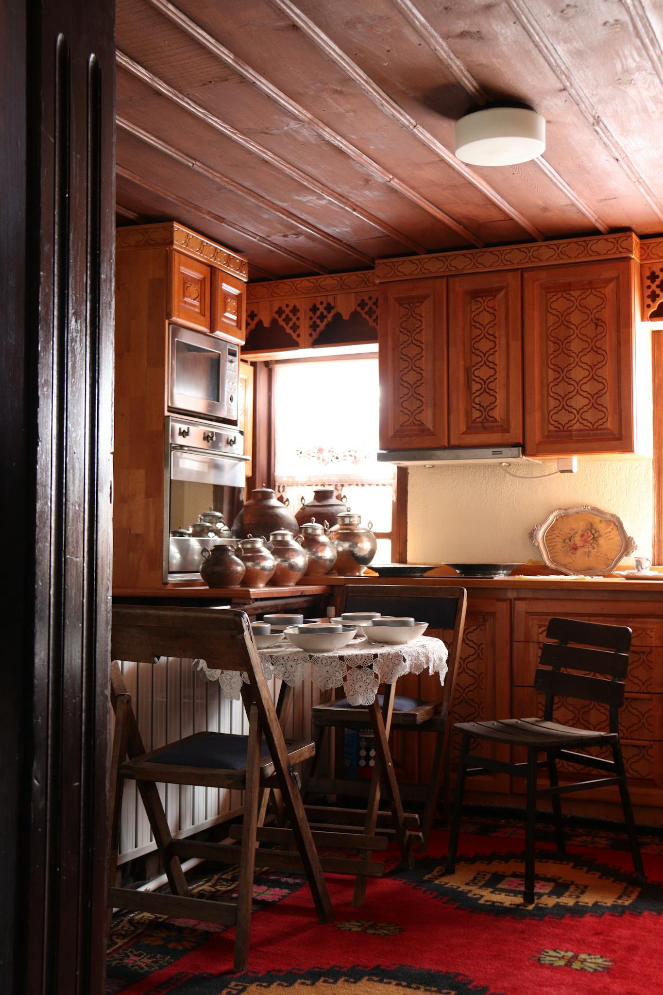 Warm and inviting rustic kitchen featuring wooden cabinets and traditional decor.